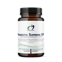 Probiotic supplement bottle with black cap and amber label, Designs for Health branding