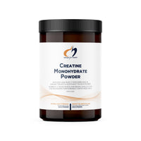 Creatine monohydrate powder supplement jar, black cap and white label